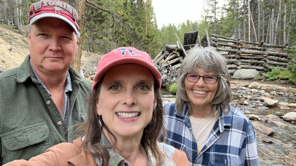 Elgin & Melissa Cook take neighbor, Wink Bennett, out for a ride in the Bighorn Mountains.