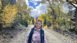 Melissa Cook stands on the Kirwin, Wyoming road during fall colors 2022