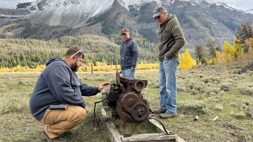 Shane, Elgin Cook, and Jason check out an old engine on the DD ranch in Wyoming