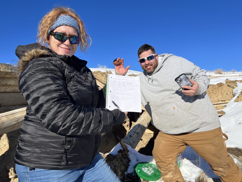 Shane Combs and Cathy at the Wyoming Jeepers cache in the badlands