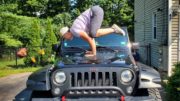 Sarah Locke in a yoga pose on her Jeep hood