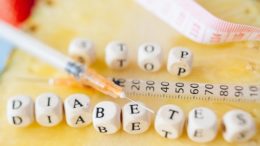 Diabetes spelled in blocks with a syringe