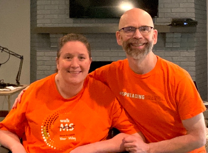 Jennifer and Dan Digmann dressed in orange to support multiple sclerosis awareness