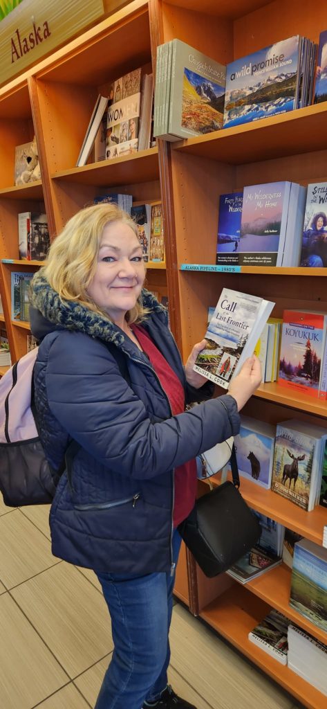 Melissa Billups shows off "The Call of the Last Frontier" memoir of Melissa Cook's Alaska and MS experiences.