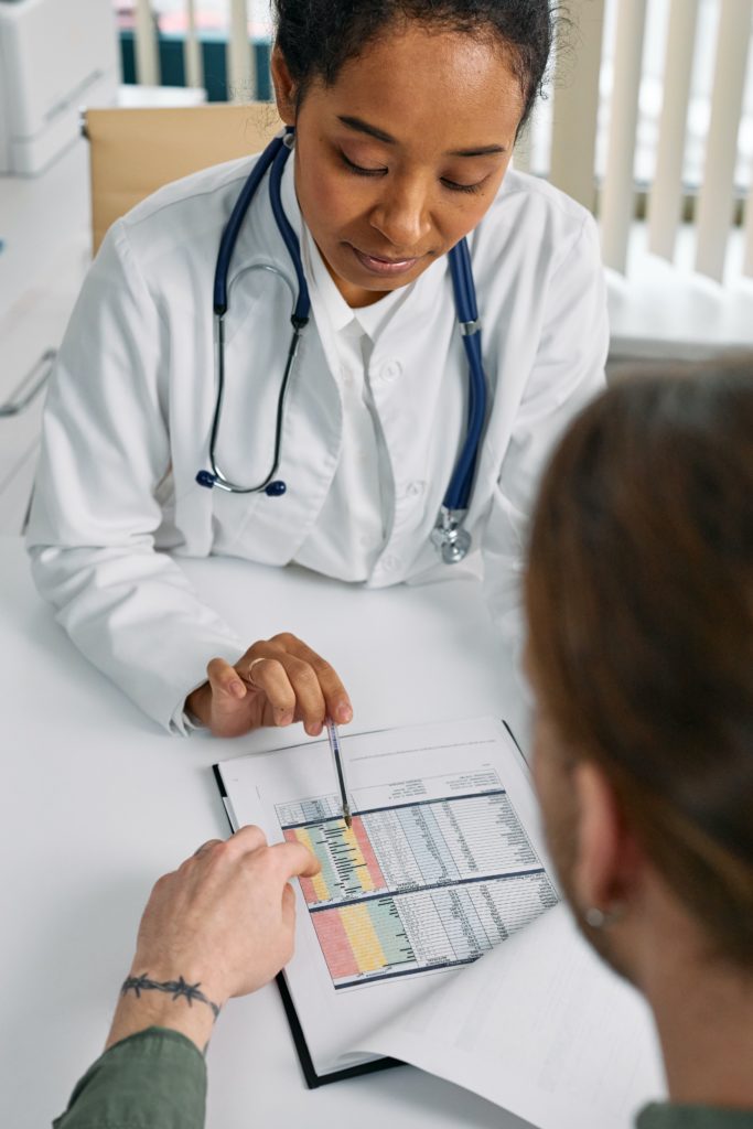 Female doctor reviews test results with patient
